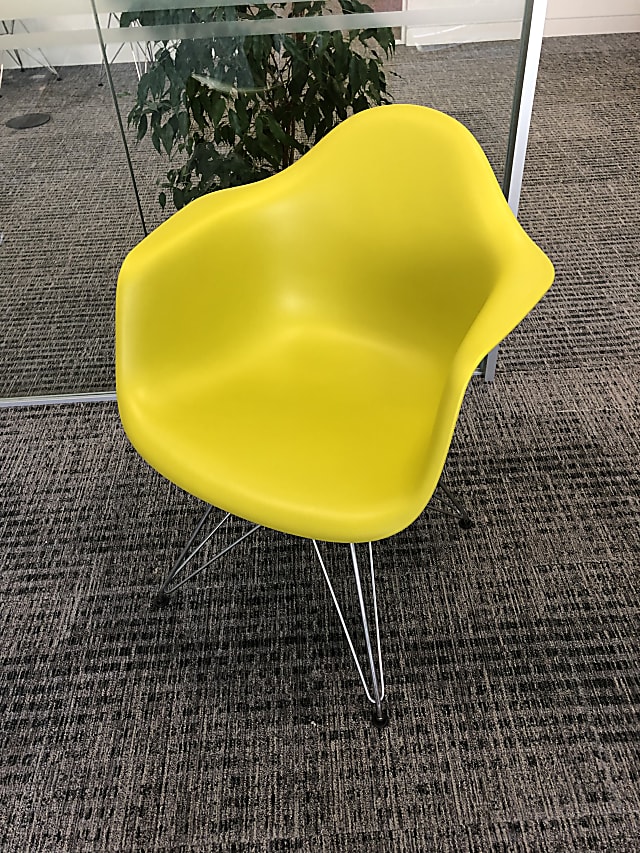 Yellow Vitra  chairs with arm rests