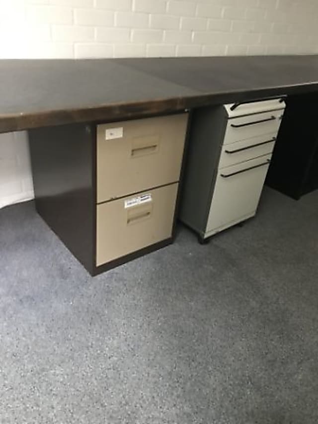 brown and black wooden pedestal desk