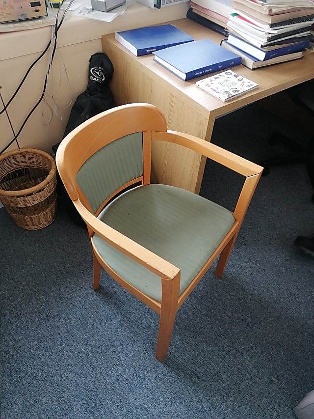 brown wooden framed green padded armchair