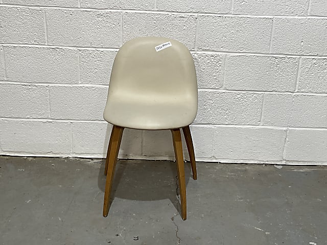 Gubi brown wooden framed cream leather padded chair