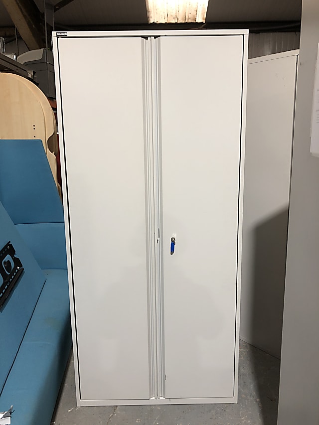 Metal storage cabinet with shelves and key