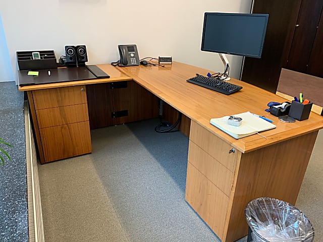 Large wooden corner desk with storage