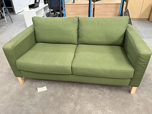 Green two seater fabric sofa