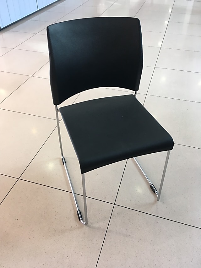 Stackable black plastic canteen chair