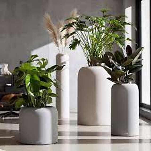 white ceramic vase and white ceramic vase