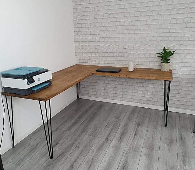 rectangular brown wooden table with gray metal base