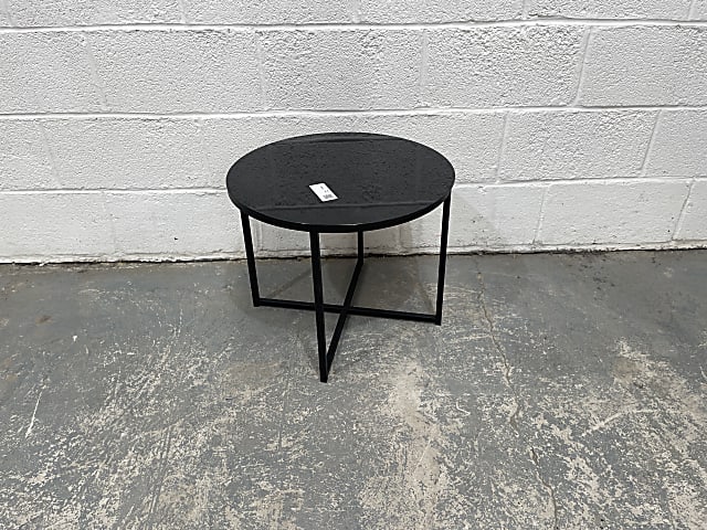 Round black metal framed glass top table