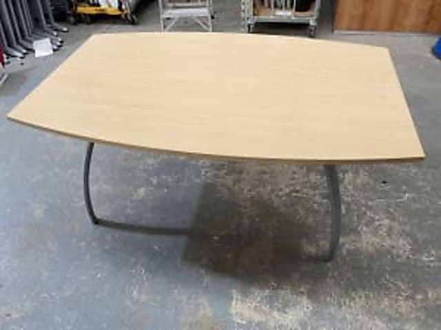 oval brown wooden top with black metal base table