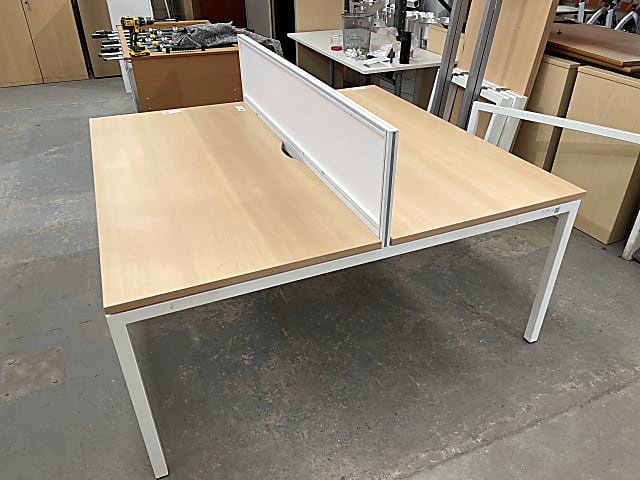 Bank of 2 desks with divider back to back