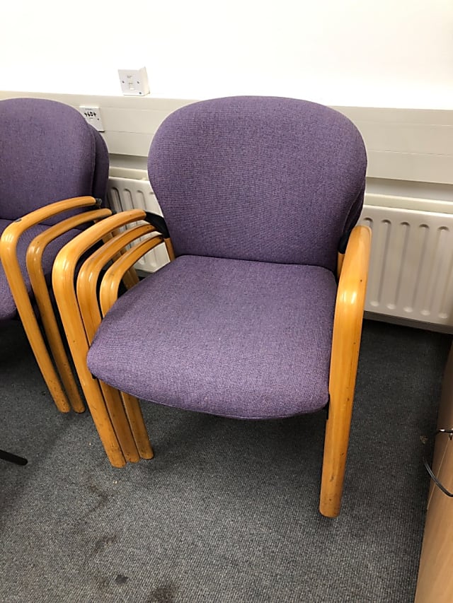 Purple padded wooden armchair