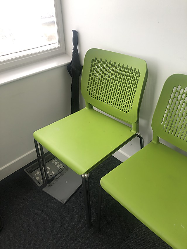 green and black plastic chair