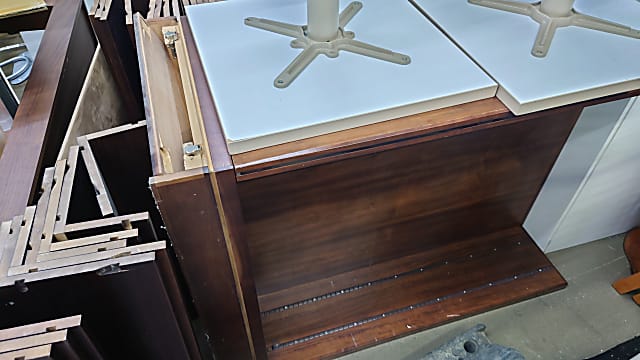 brown damaged wooden strorage cabinet