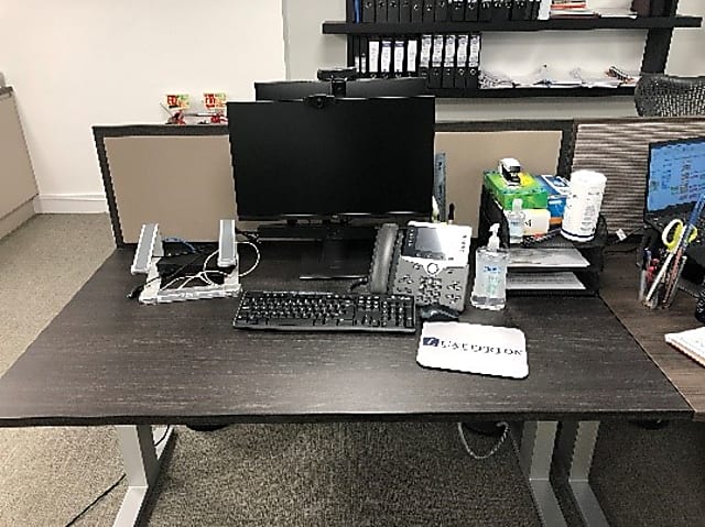 Dark brown office desk with grey legs