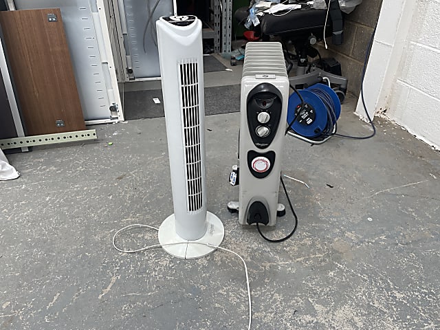 two white and black tower fans