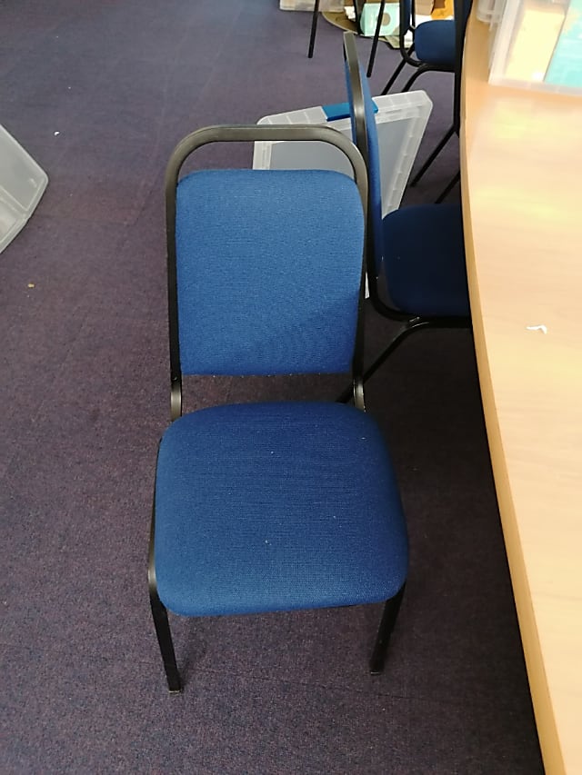 Blue padded stacking chair