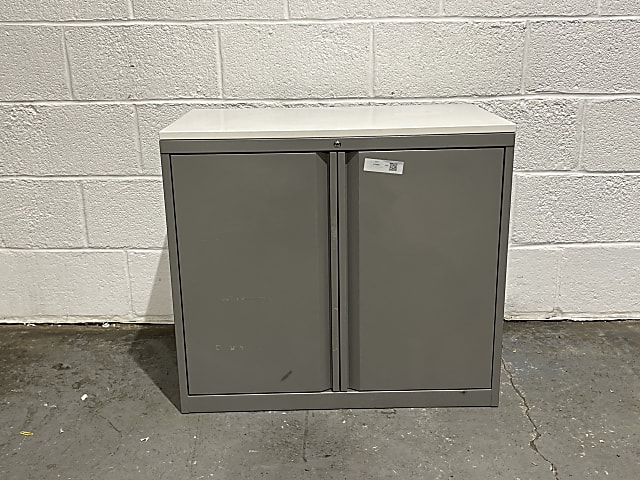 Small grey cabinet with key