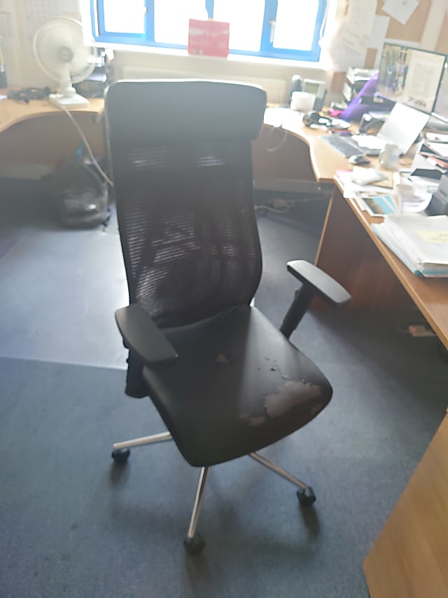 Black operator chair head rest