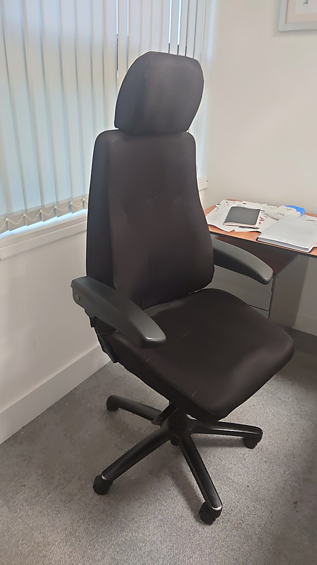 black leather padded operator chair