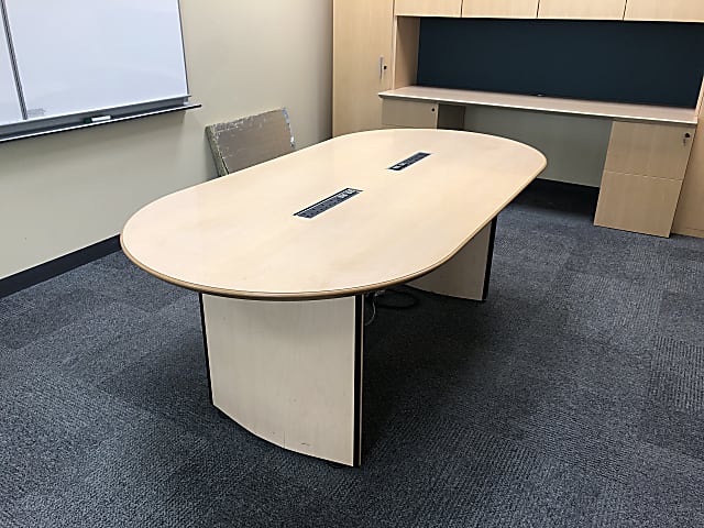 Streched circular meeting table with desk power