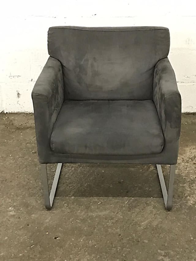 Grey upholstered Swedese sled armchair