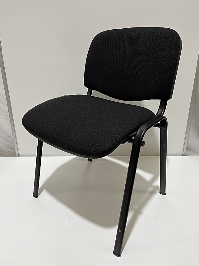 Black padded stacking chair