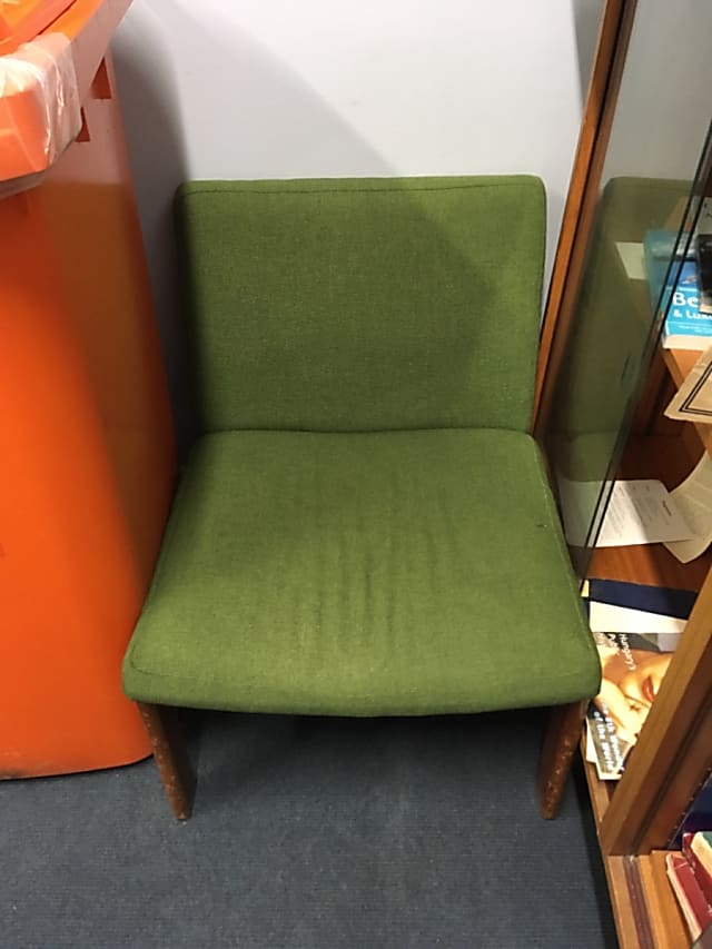 Green padded sofa chair