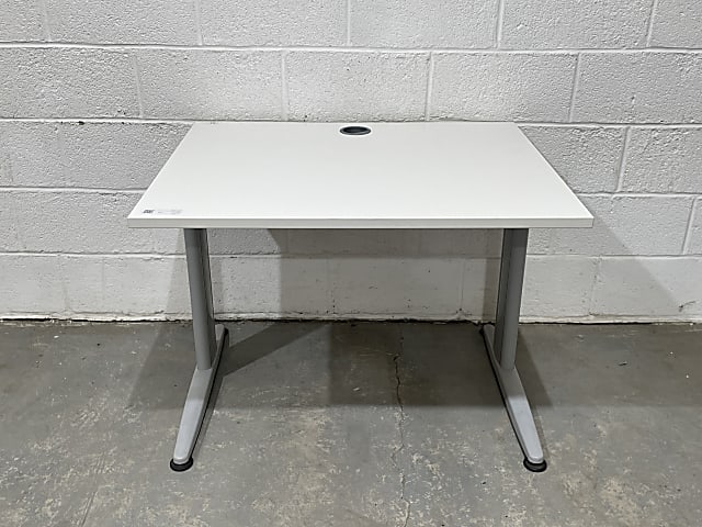 Small straight white wooden desk with gray metal base