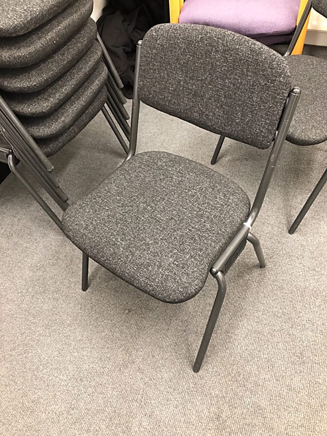 Grey fabric padded waiting room chair with metal frame