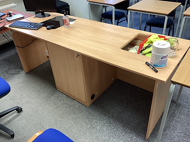 brown wooden computer desk with central storage