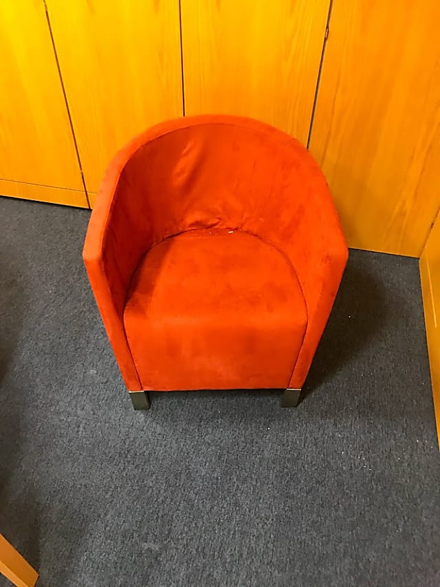 Orange plush fabric armchair