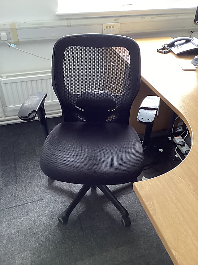 Black operator chair mesh back (no brand label)