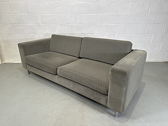 Green two seater sofa