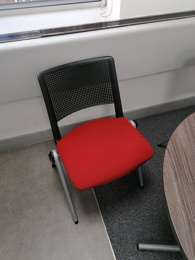 red and black rolling chair