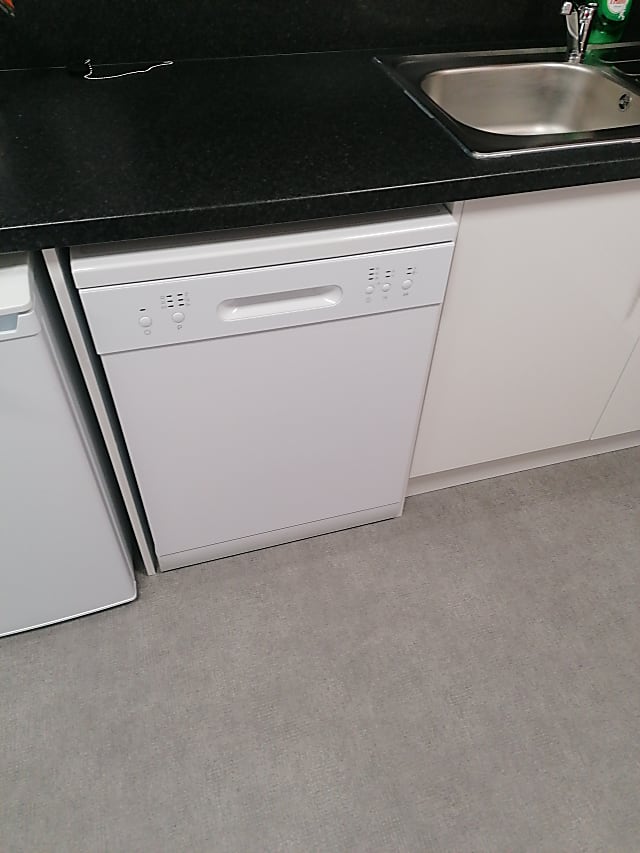 white and black Whirlpool dishwasher