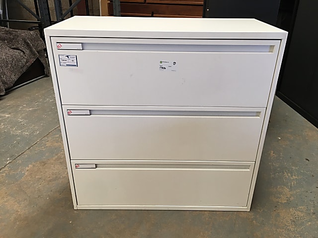 White metal filing cabinet three drawers