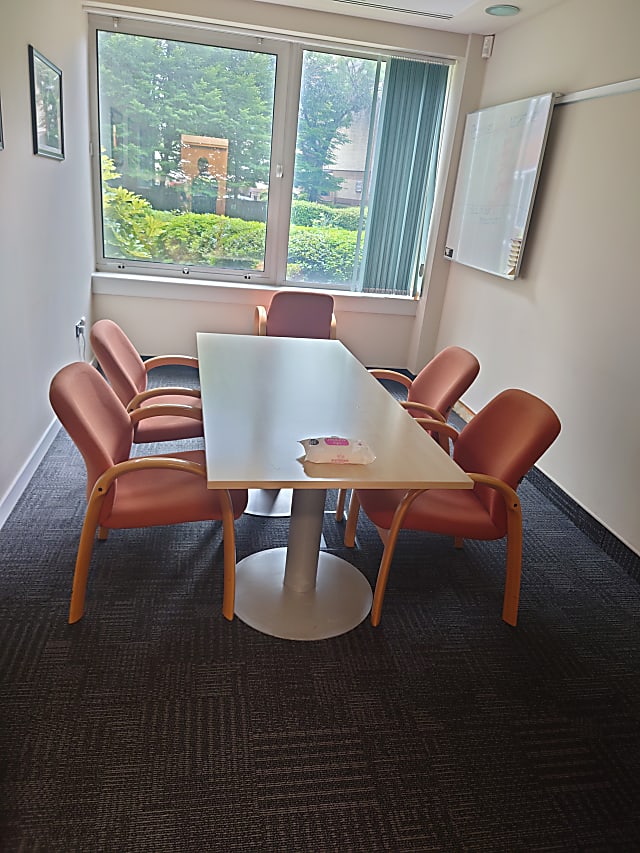 meeting table with 2 solid round base plates