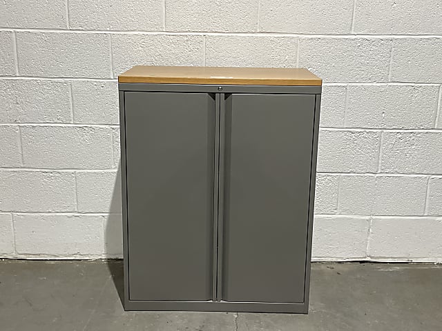 Two door medium dark grey cabinet with brown wooden top