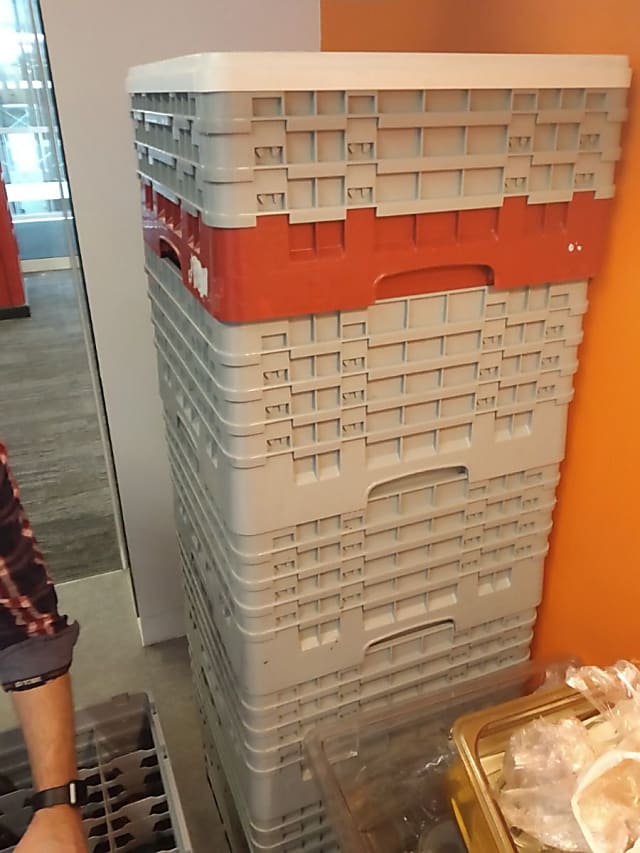 gray and orange plastic drinks crates