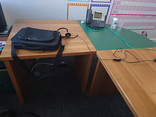 L shape desk with green curved edge