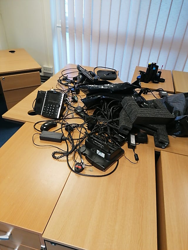 box of phones and IT equipment