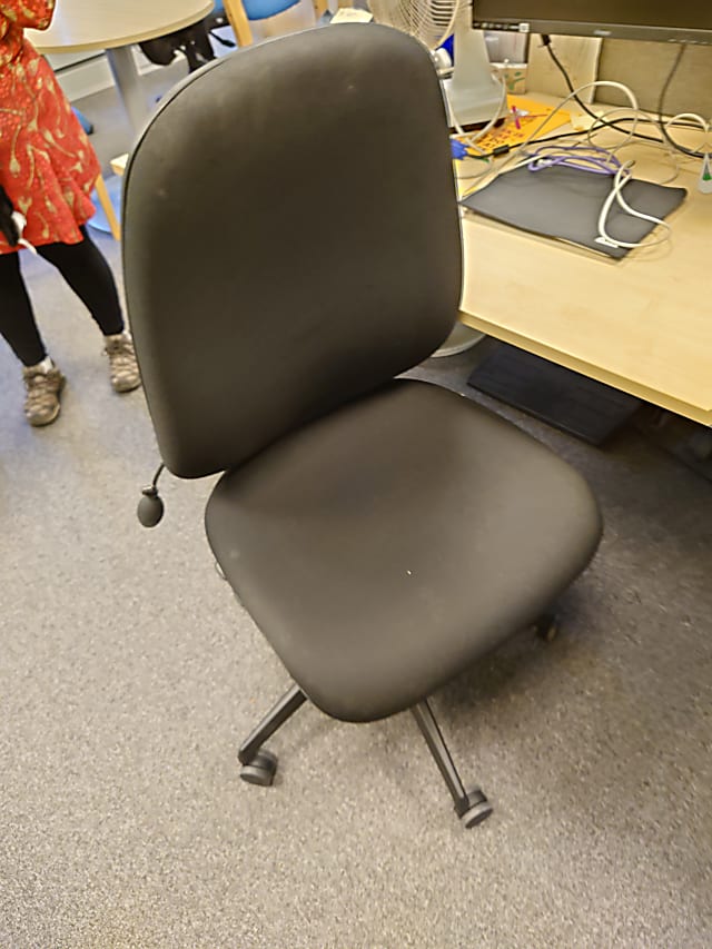 Black operator chair no arm rests