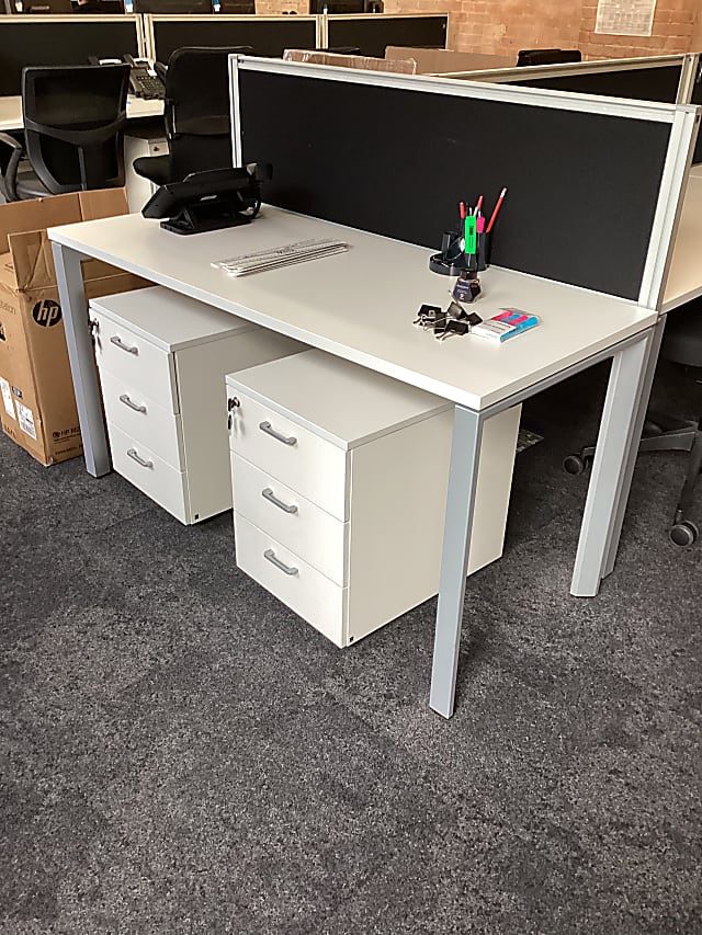 white wooden ground floor single desks