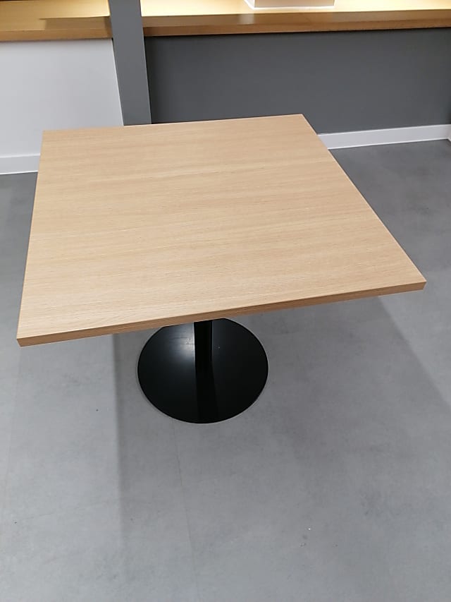 brown wooden table with black metal base