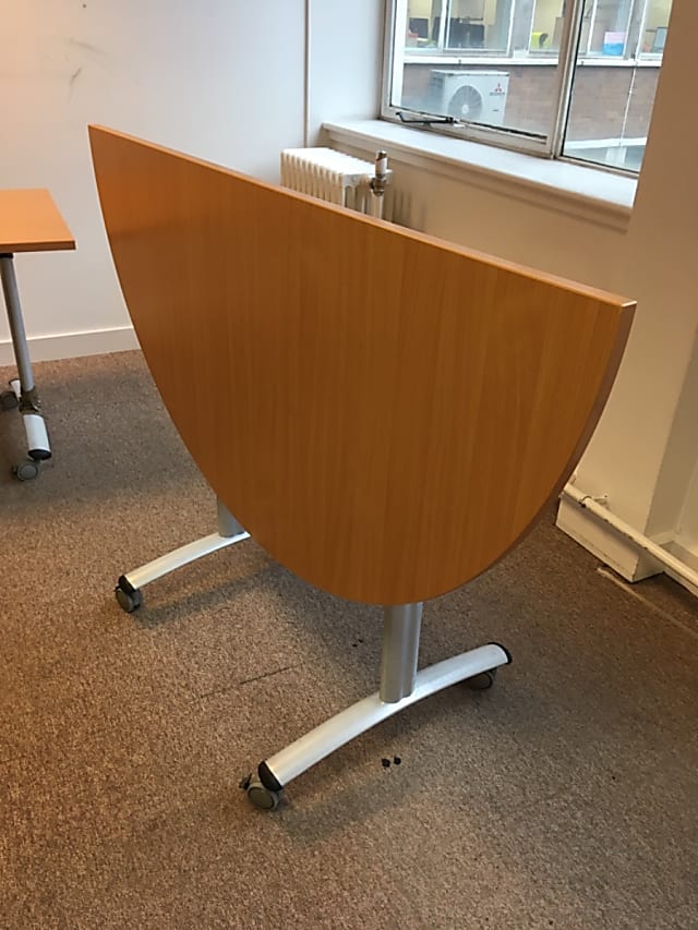 Folding semi-circular table on wheels