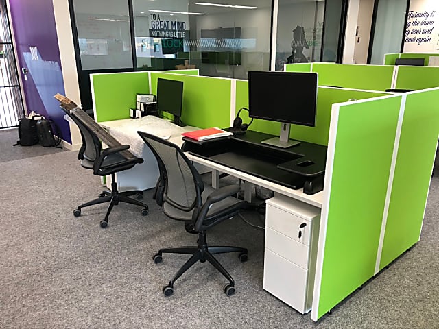 Green fabric desk privacy panel, floor standing