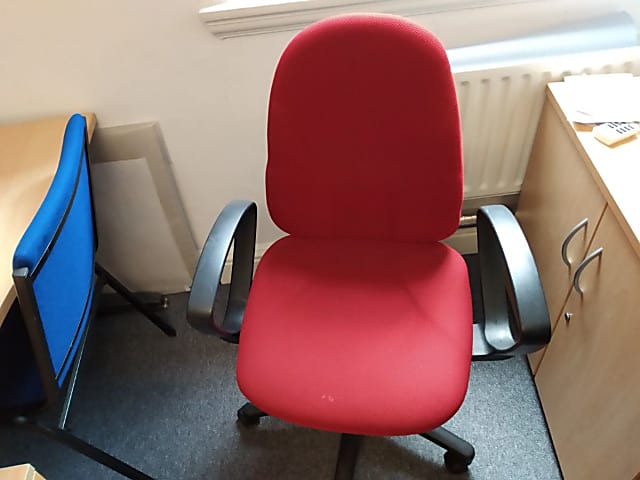 red fabric pad rolling armchair