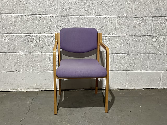 brown wooden framed purple padded chair