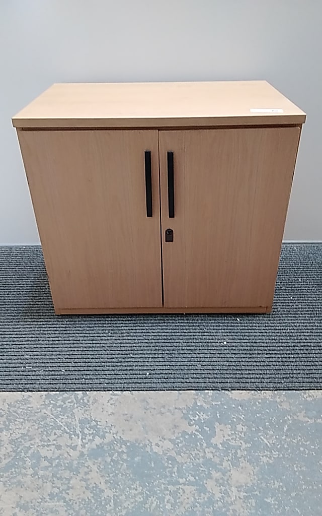 Low wooden cabinet with key