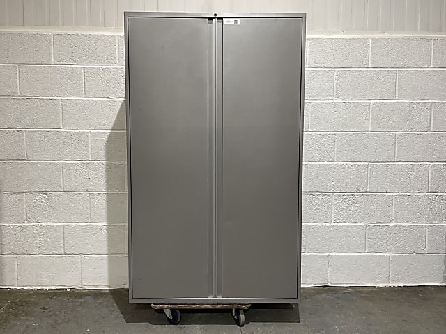 Tall grey metal storage cabinet with internal shelves