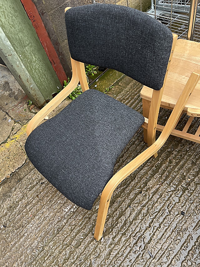 brown wooden framed black padded chair